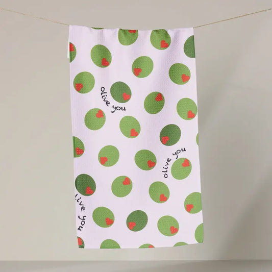 Tea towel with green and red polka dot pattern and 'alive you' text on a white background