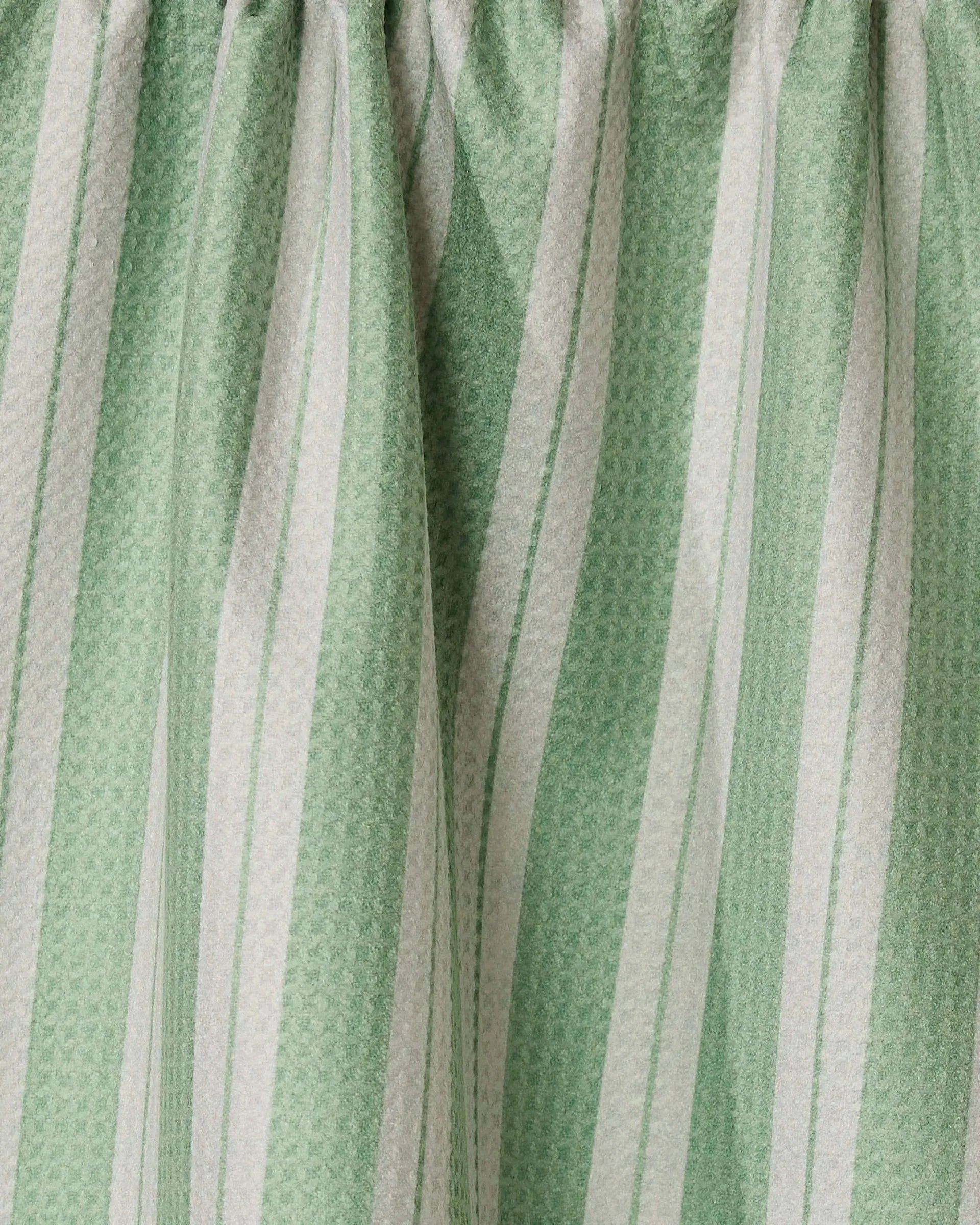 Close-up of green and white striped fabric texture