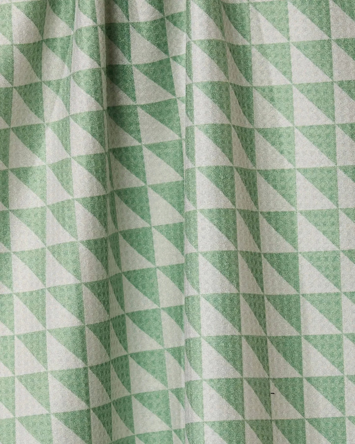 Close-up of green and white triangle patterned fabric