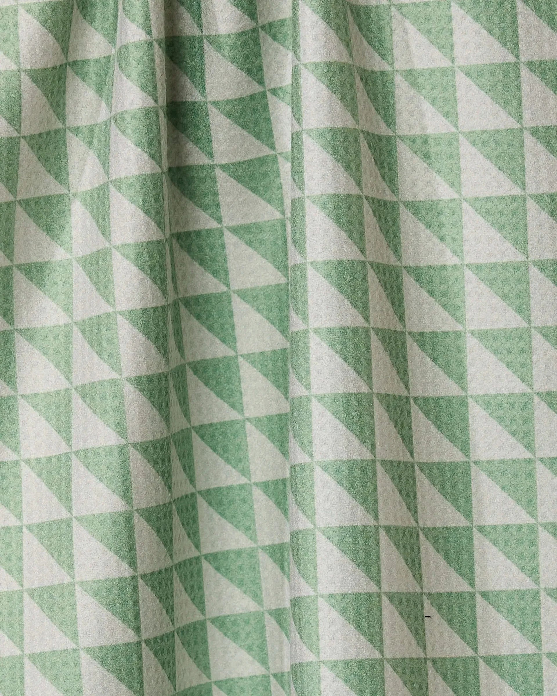 Close-up of green and white triangle patterned fabric