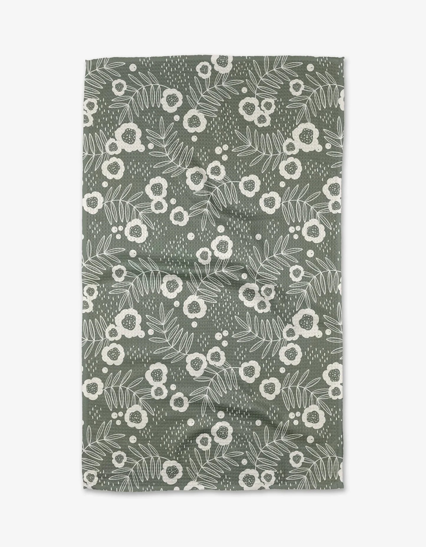 Floral patterned fabric swatch on a green background