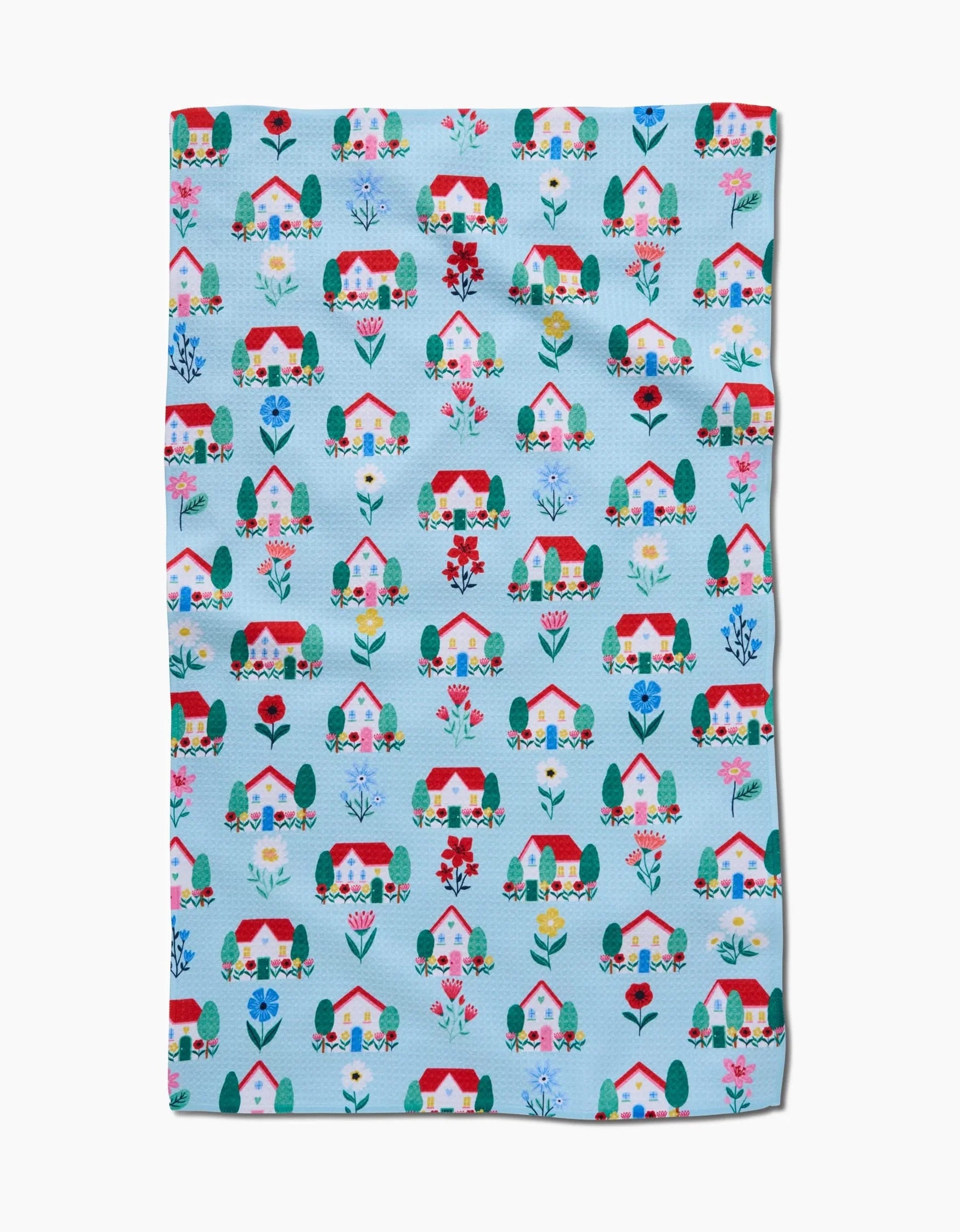 Fabric with house and garden pattern on a blue background