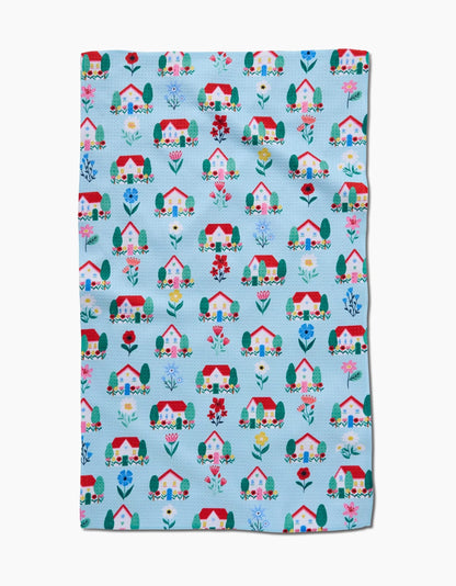 Fabric with house and garden pattern on a blue background
