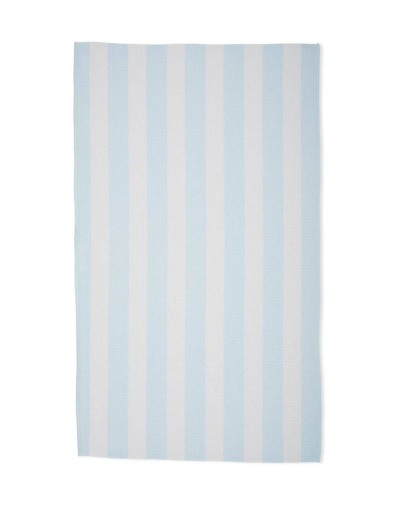 Striped rug with light blue and white stripes on a white background