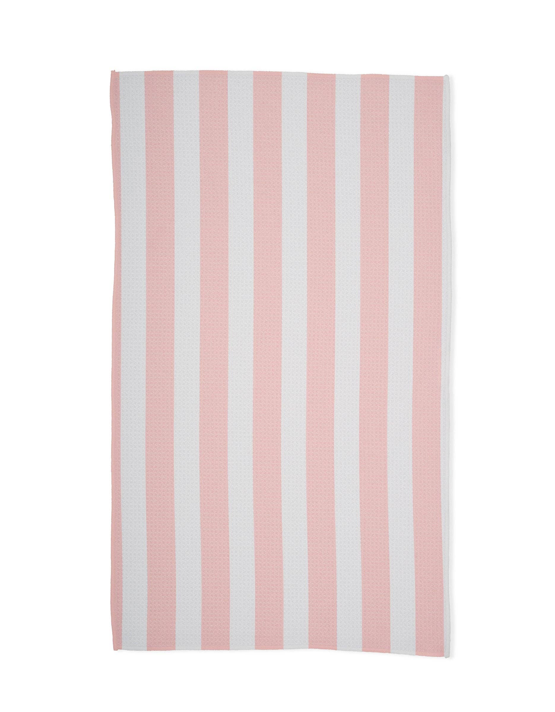Towel with pink and white vertical stripes on a white background
