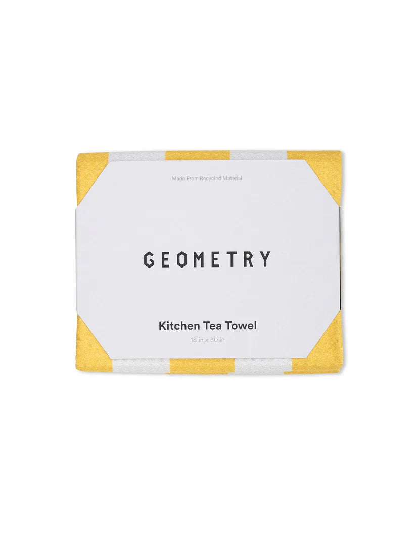 Packaged kitchen tea towel with yellow borders and 'Geometry' branding on a white background