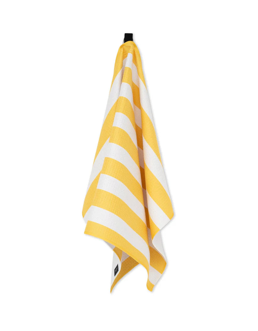 Yellow and white striped towel on a white background