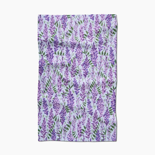 Floral patterned fabric with purple flowers on a white background