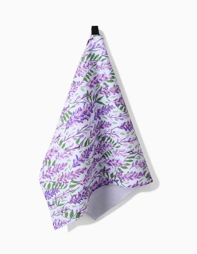 Floral patterned towel with purple flowers on a white background