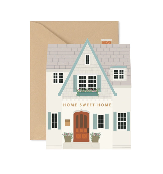 Greeting card with a house illustration and 'Home Sweet Home' text, featuring a brown envelope.