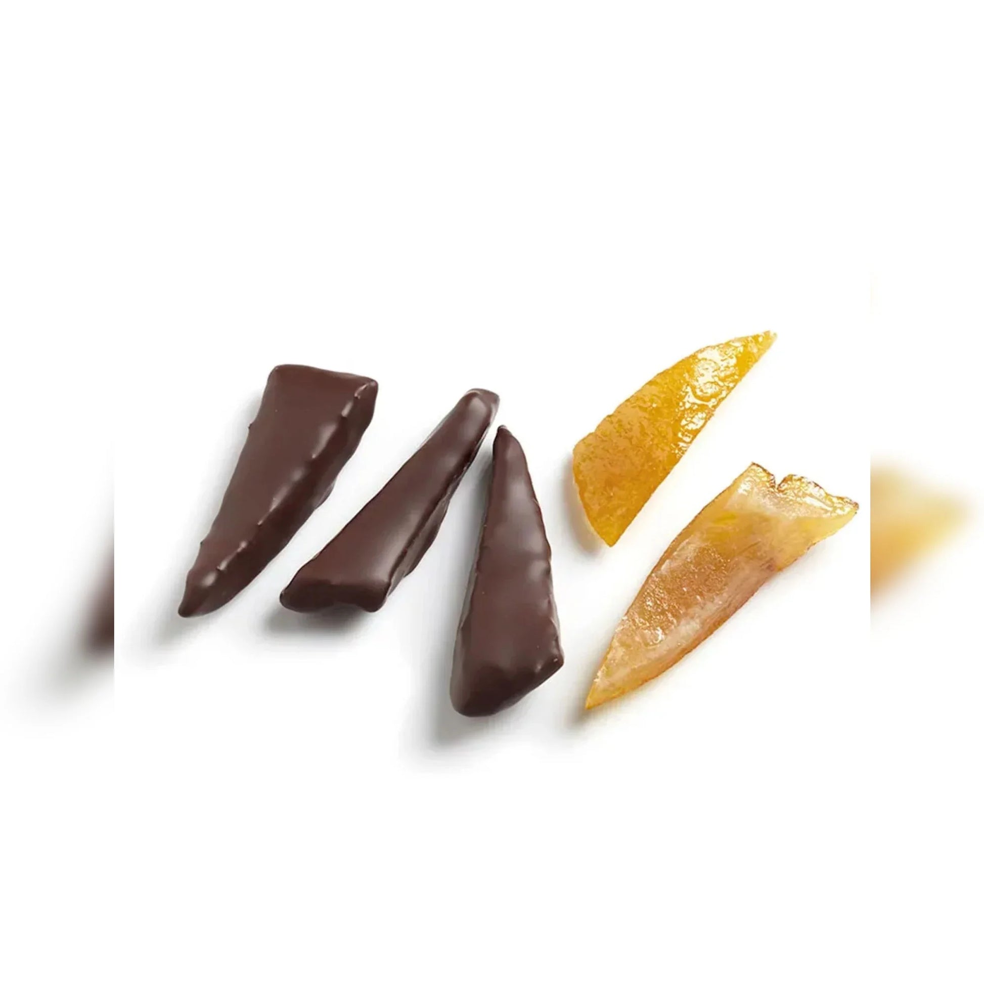 Three chocolate-dipped fruit sticks on a white background