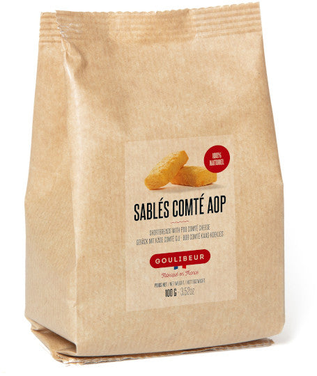 Kraft paper bag with a label for Sables Comte AOP on a white background