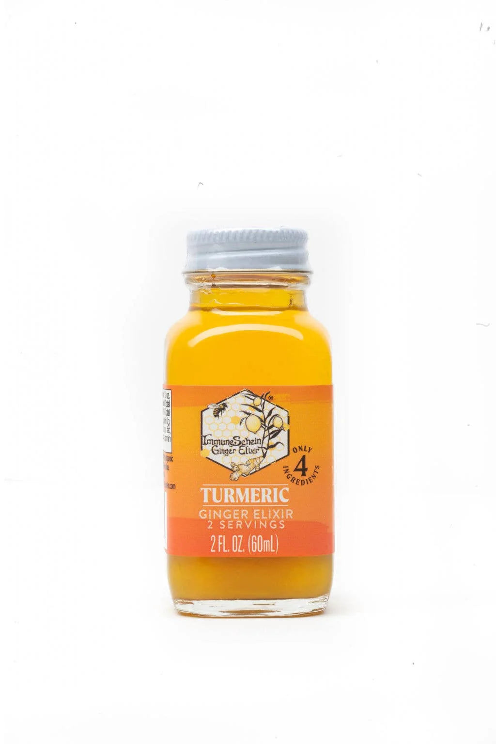 Bottle of turmeric ginger elixir on a white background