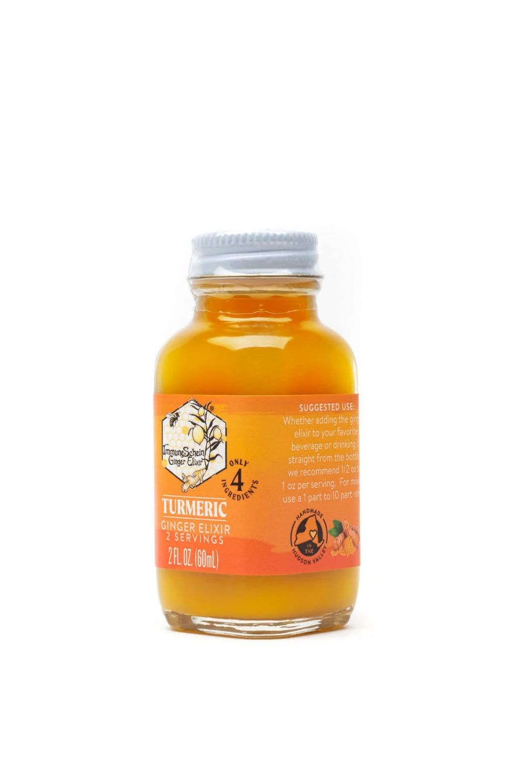 Bottle of turmeric ginger elixir on a white background