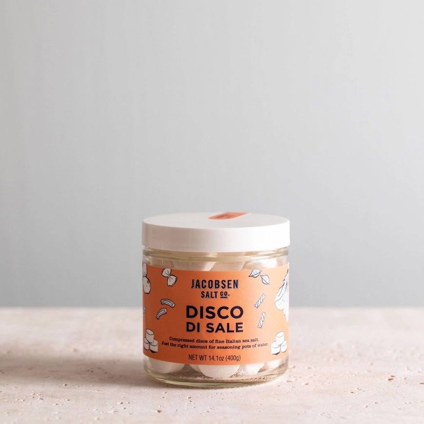 Jar of Jacobsen Salt Co. Disco Di Sale on a light surface with a gray background