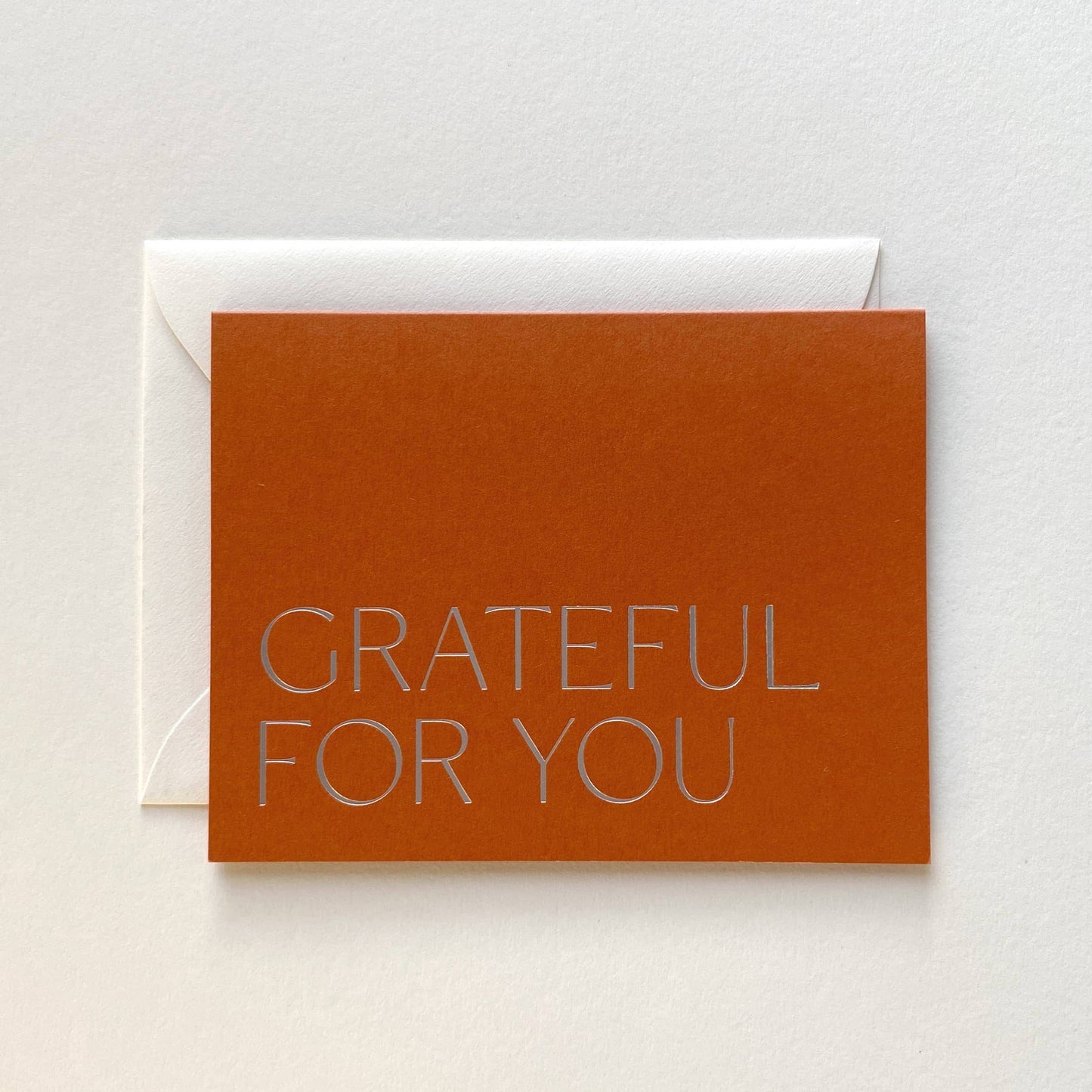 Brown card with 'GRATEFUL FOR YOU' text on a white background