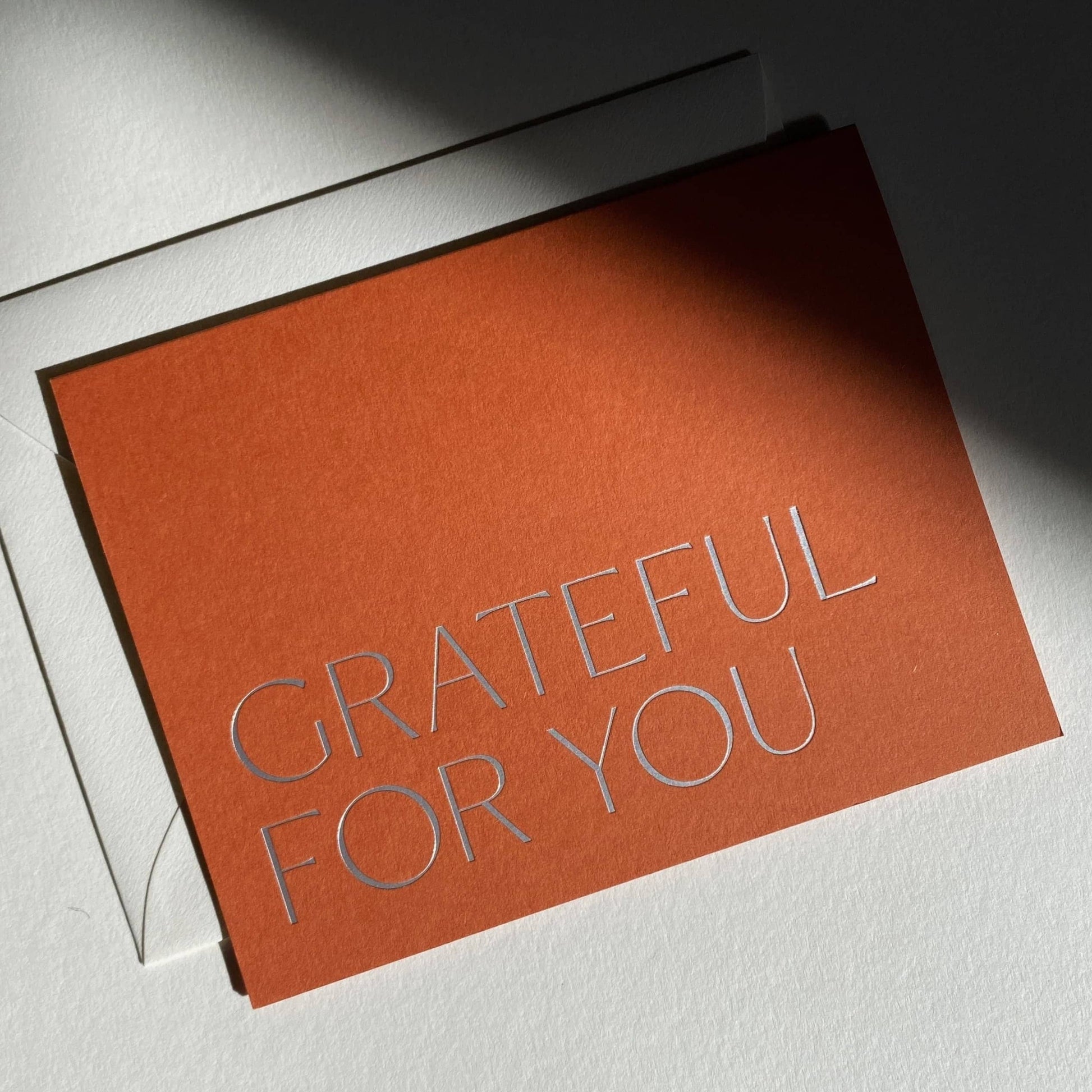 Orange card with 'Grateful for You' text on a white background