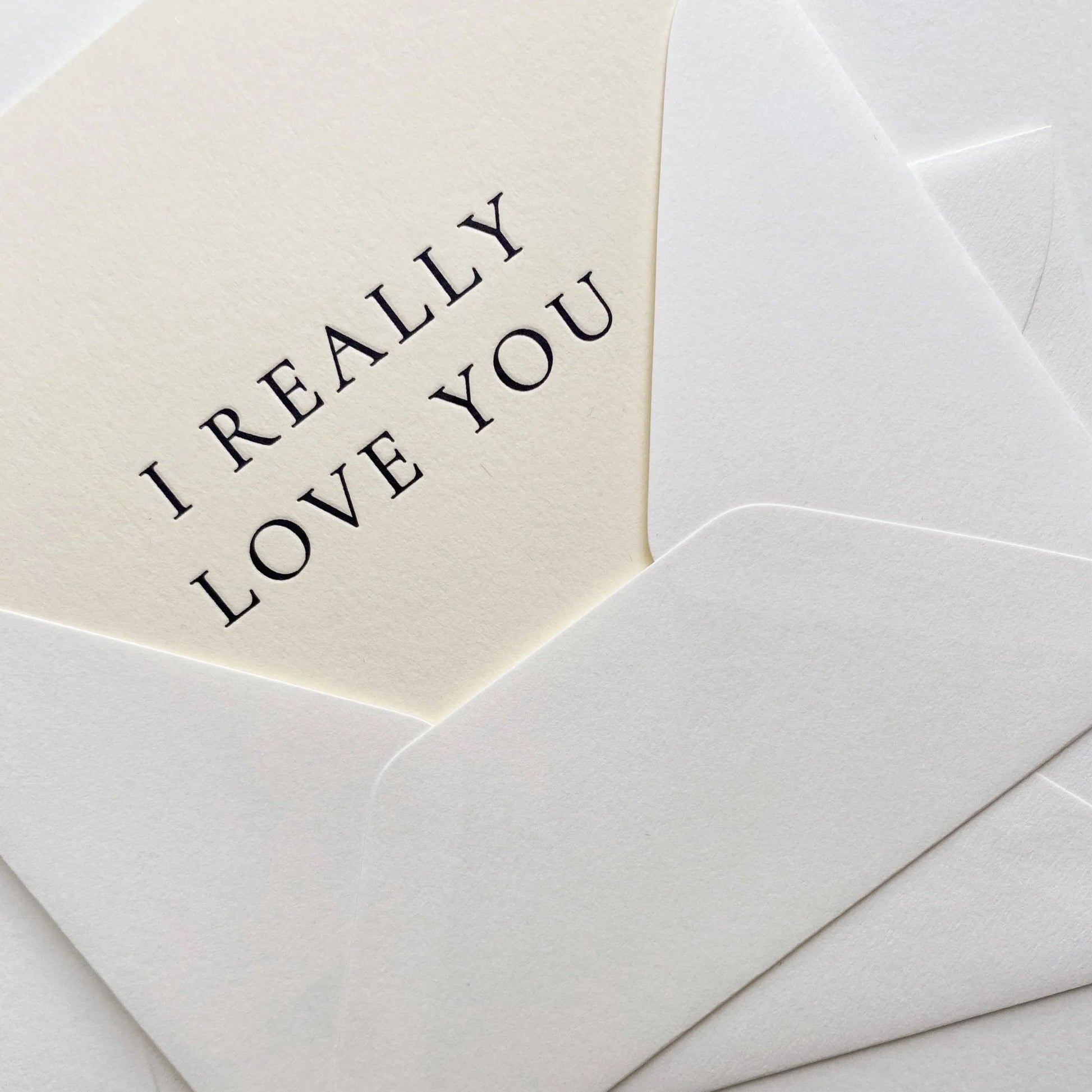 Envelope with 'I REALLY LOVE YOU' message on a white background
