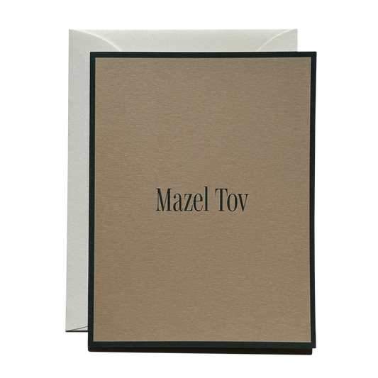 Brown card with 'Mazel Tov' text on a white background