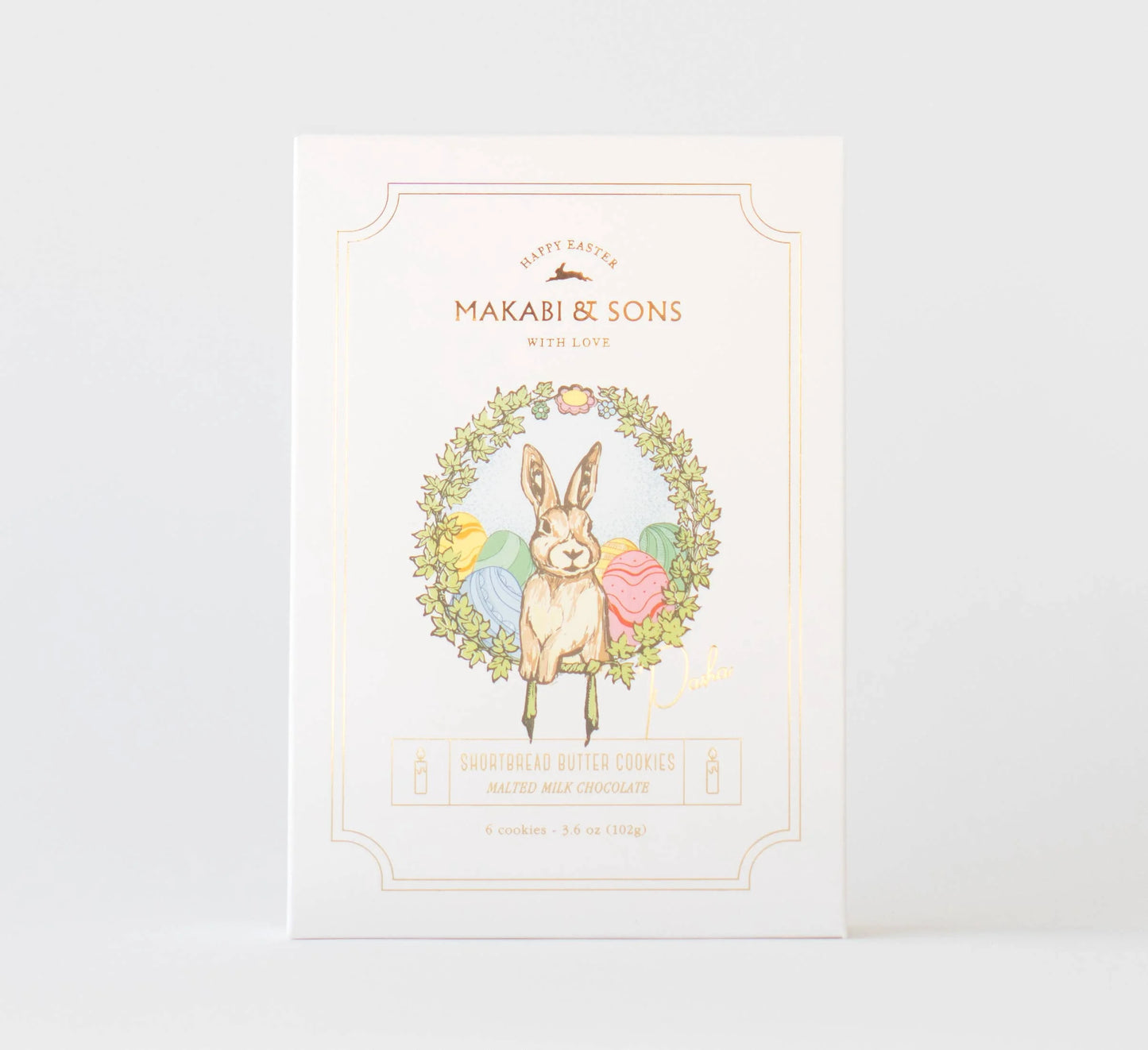 Product packaging with a rabbit illustration and floral wreath on a white background