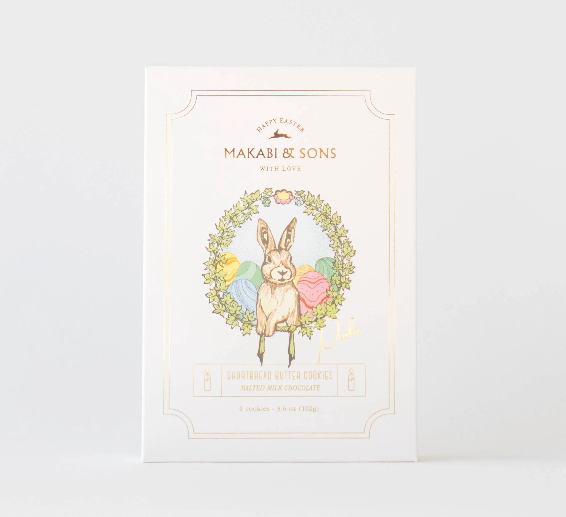 Product packaging with a rabbit illustration and floral wreath on a white background