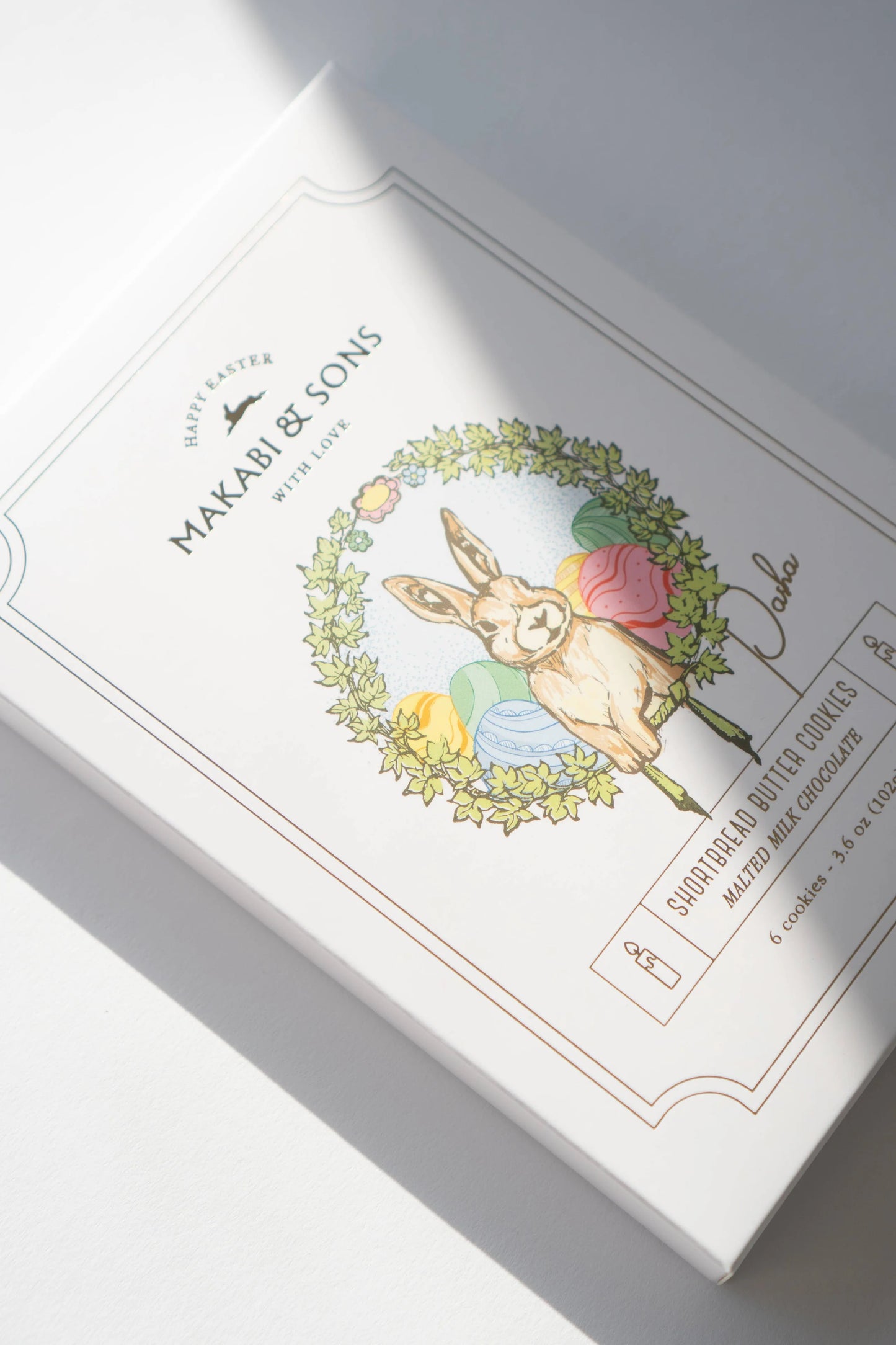 Product packaging with decorative label featuring a rabbit illustration on a white background