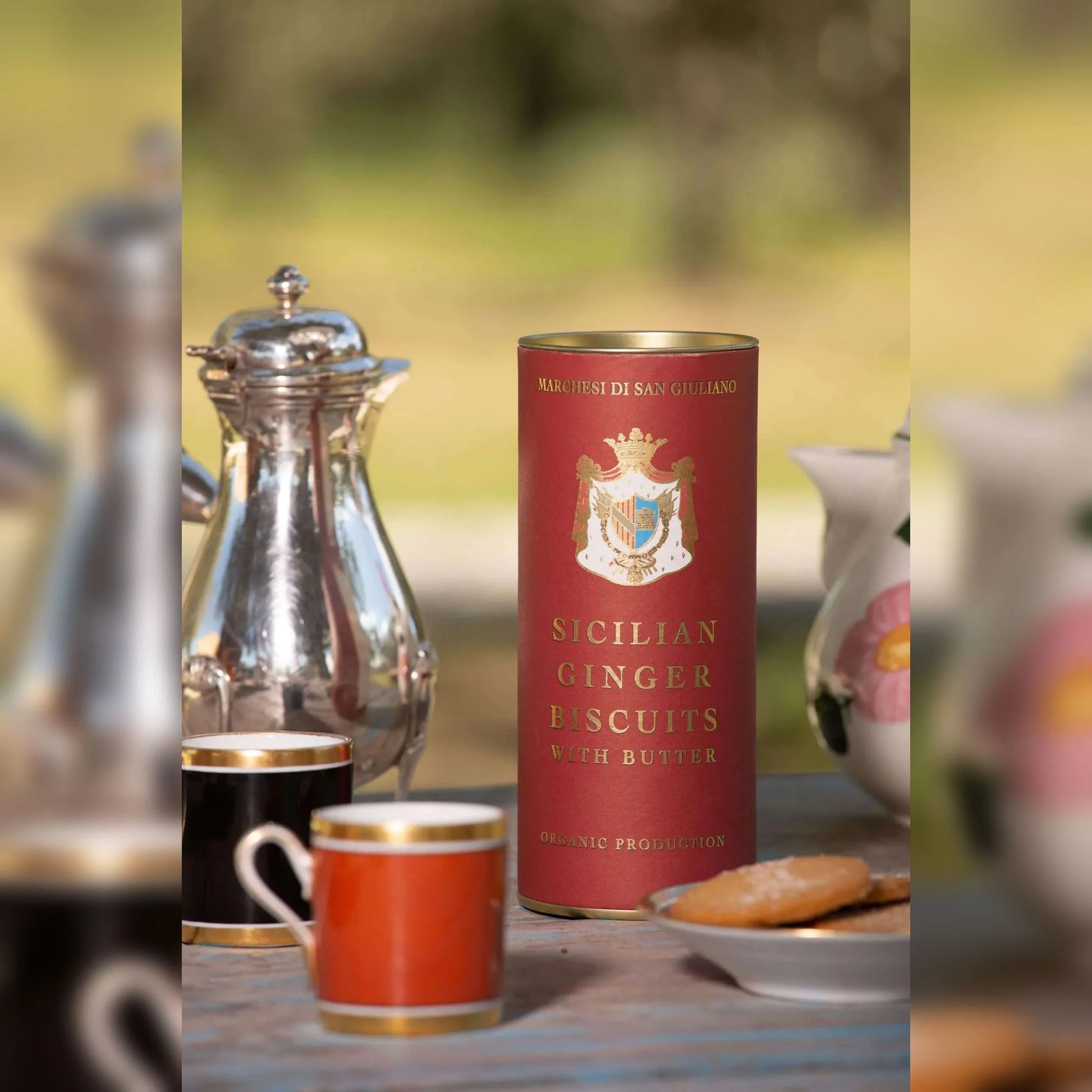 Sicilian Ginger Biscuits with Butter canister on a table with tea set