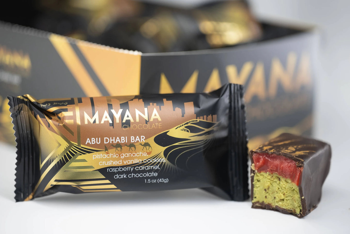 Mayana Abu Dhabi chocolate bar with packaging in the background