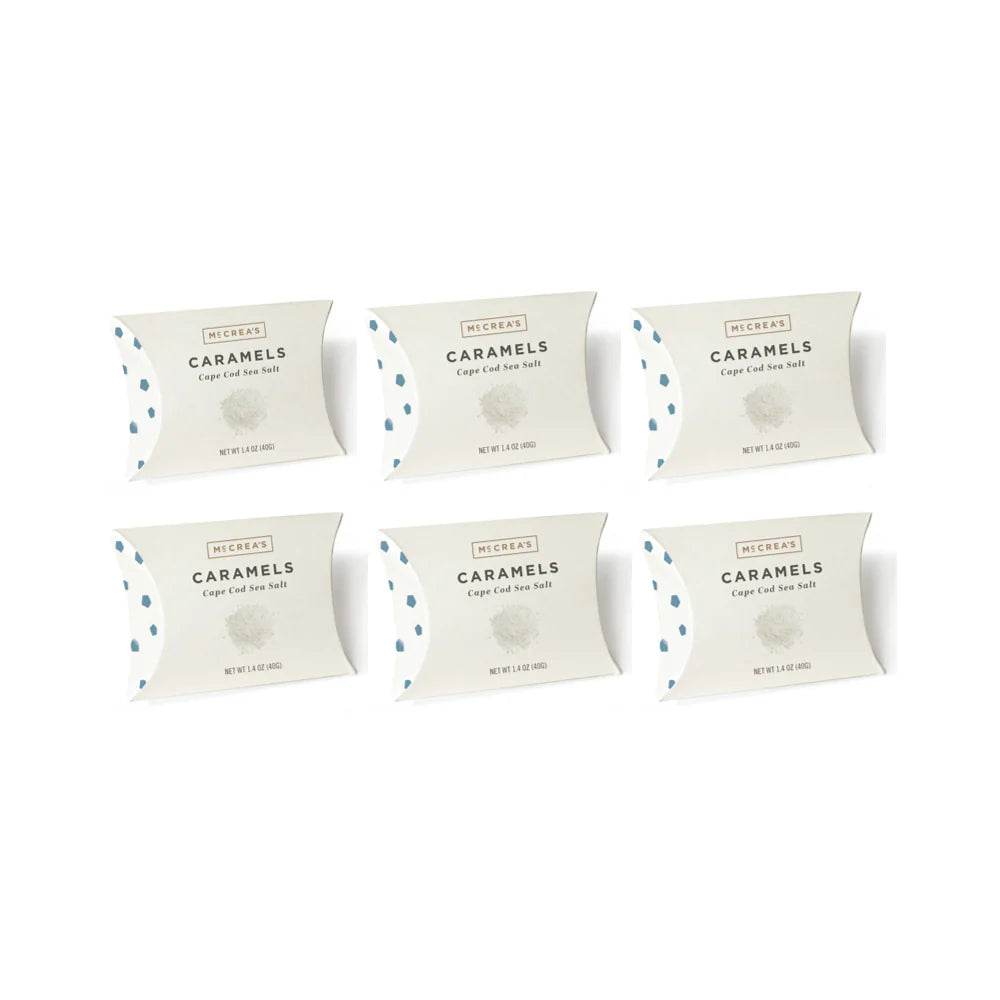 Six packages of Caramels on a white background