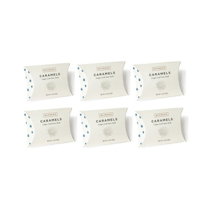 Six packages of Caramels on a white background