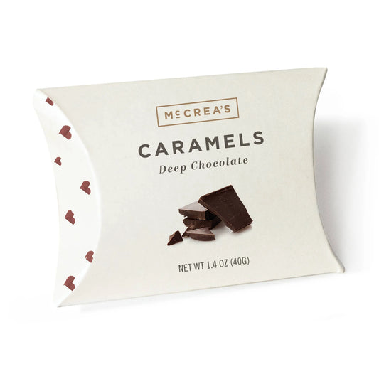 Packaged deep chocolate caramels with McCrea's branding on a white background
