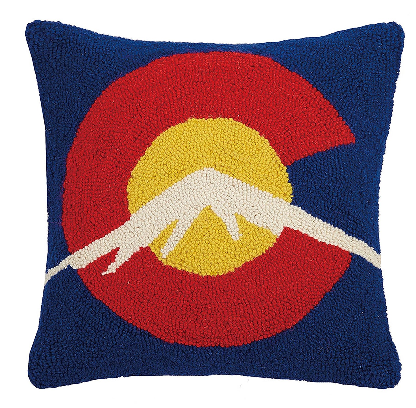 Decorative pillow with a mountain design on a blue background
