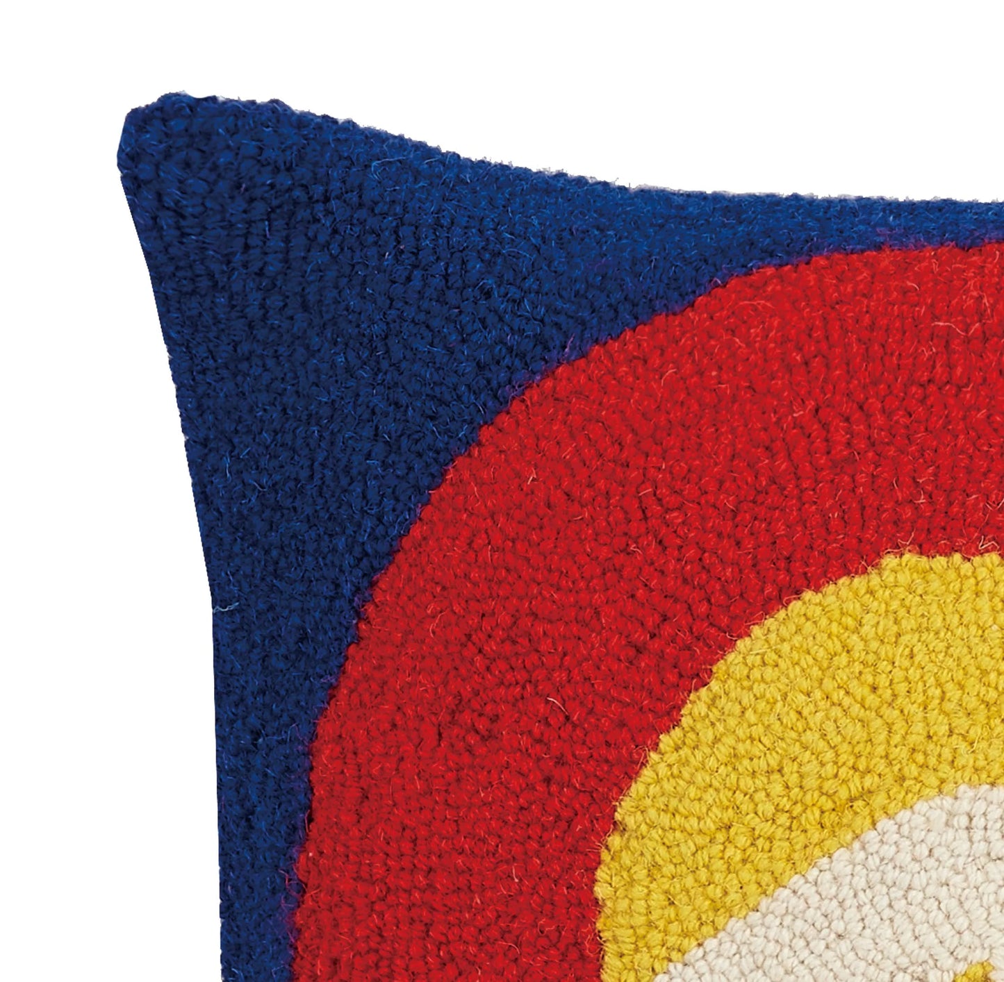 Close-up of a textured pillow with a colorful design on a white background