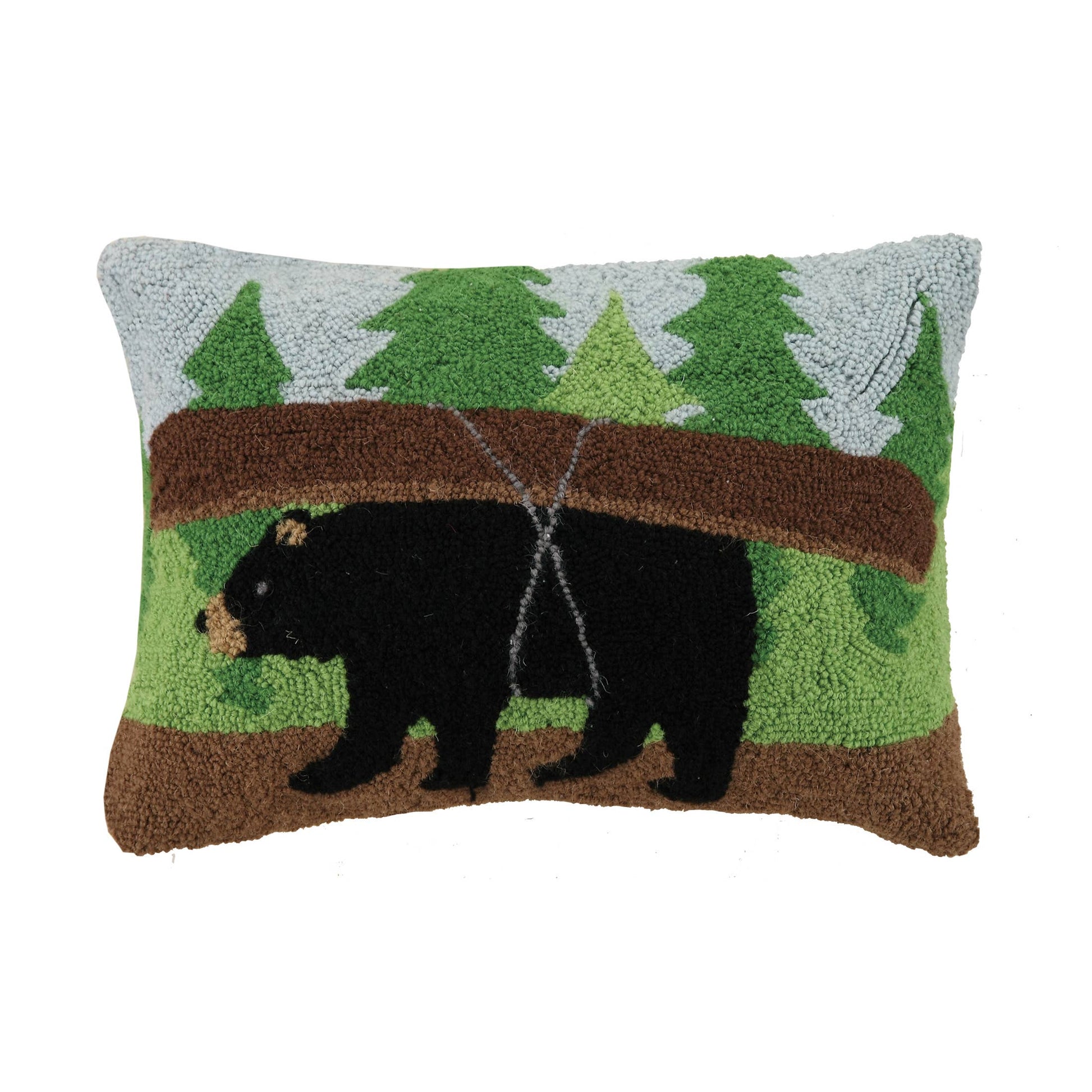 Decorative pillow with bear and forest design on a white background