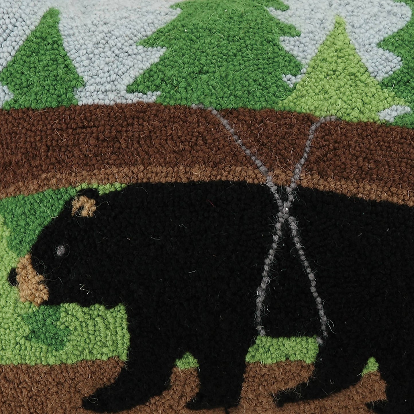 Rug with a bear and forest design, featuring a black bear holding a fish in a forest setting.