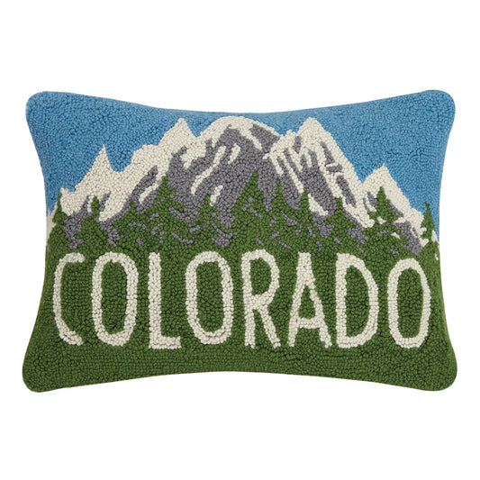 Decorative pillow with embroidered mountains and 'Colorado' text on a white background