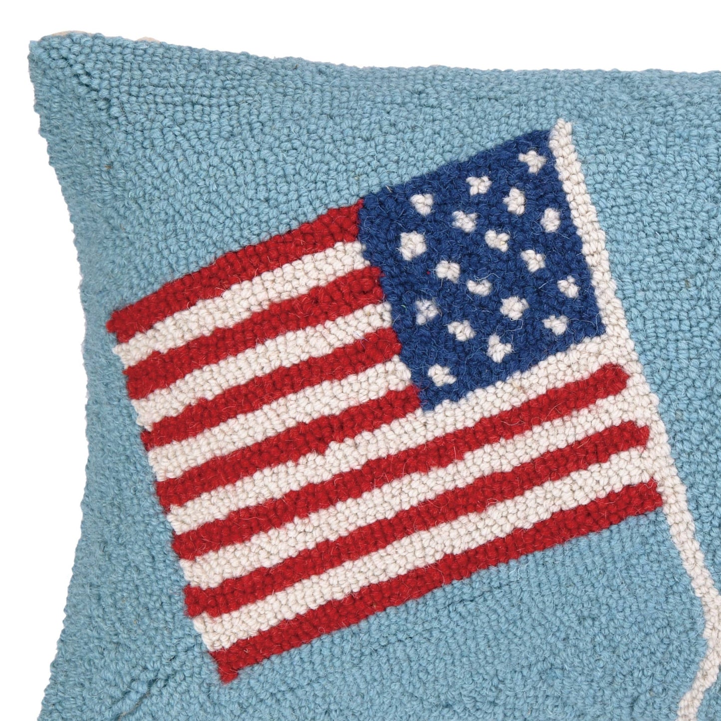 Pillow with an American flag design on a blue background