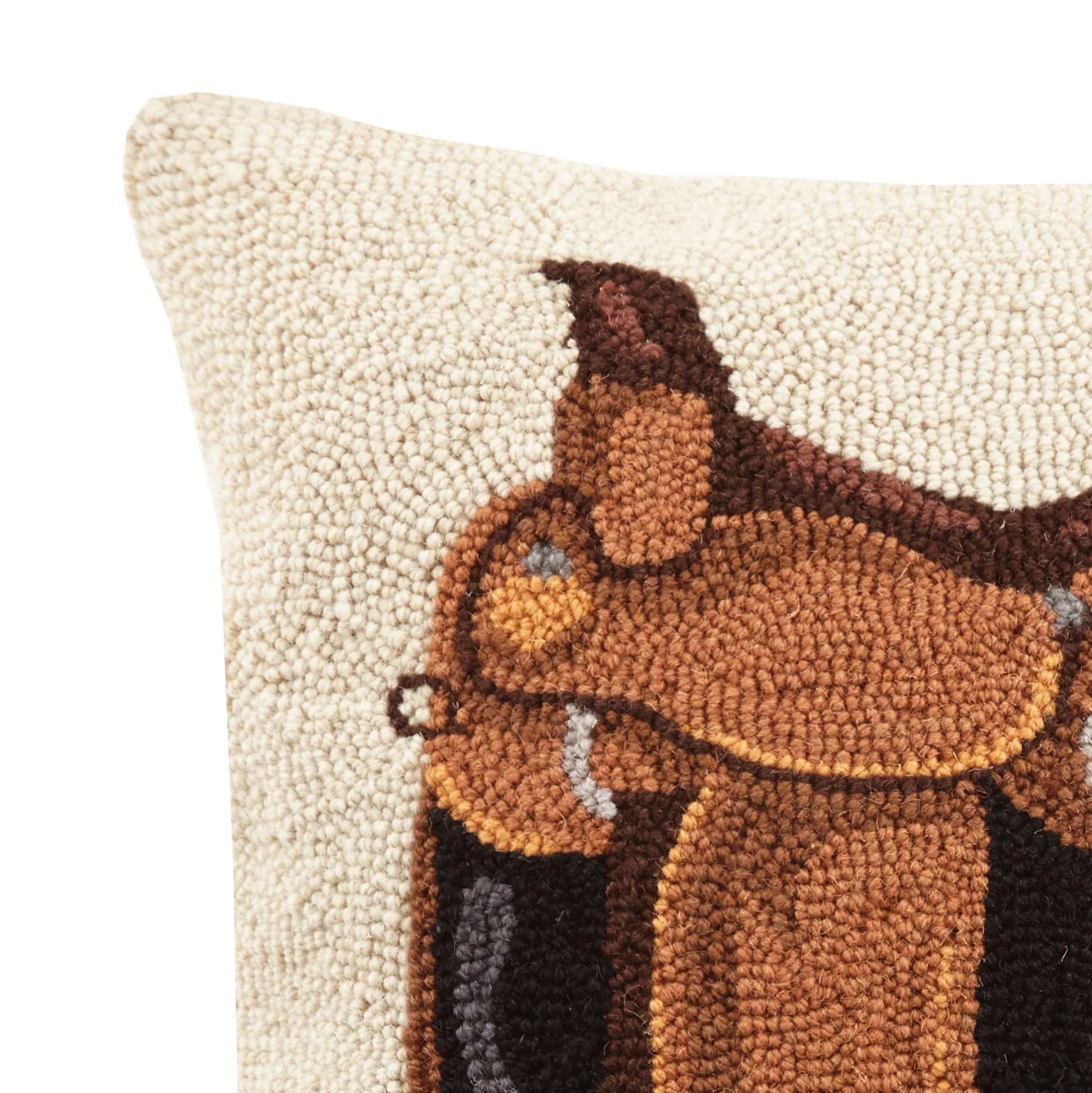 Decorative pillow with a brown bear design on a white background
