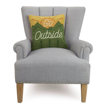 Gray armchair with a decorative pillow that says 'Go Outside' on a white background