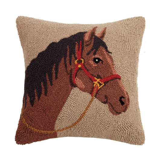 Decorative pillow with a horse design on a beige background
