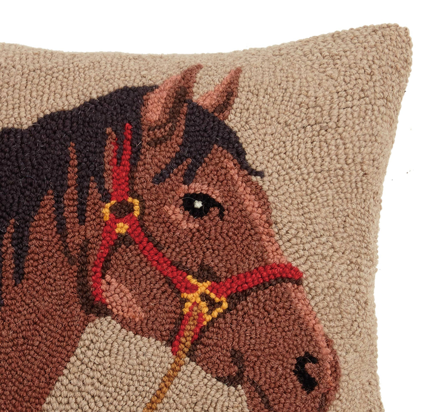 Decorative pillow with a horse design on a beige background