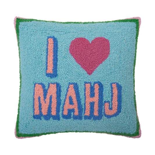 Decorative pillow with 'I ❤️ MAHJ' text on a blue background