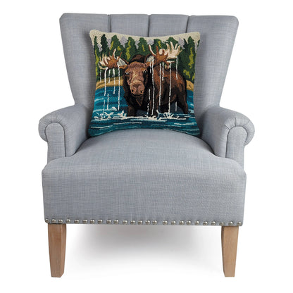 Gray armchair with a decorative pillow featuring moose and nature design on a white background