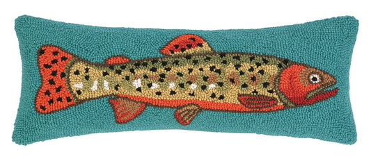 Decorative pillow with a fish design on a teal background