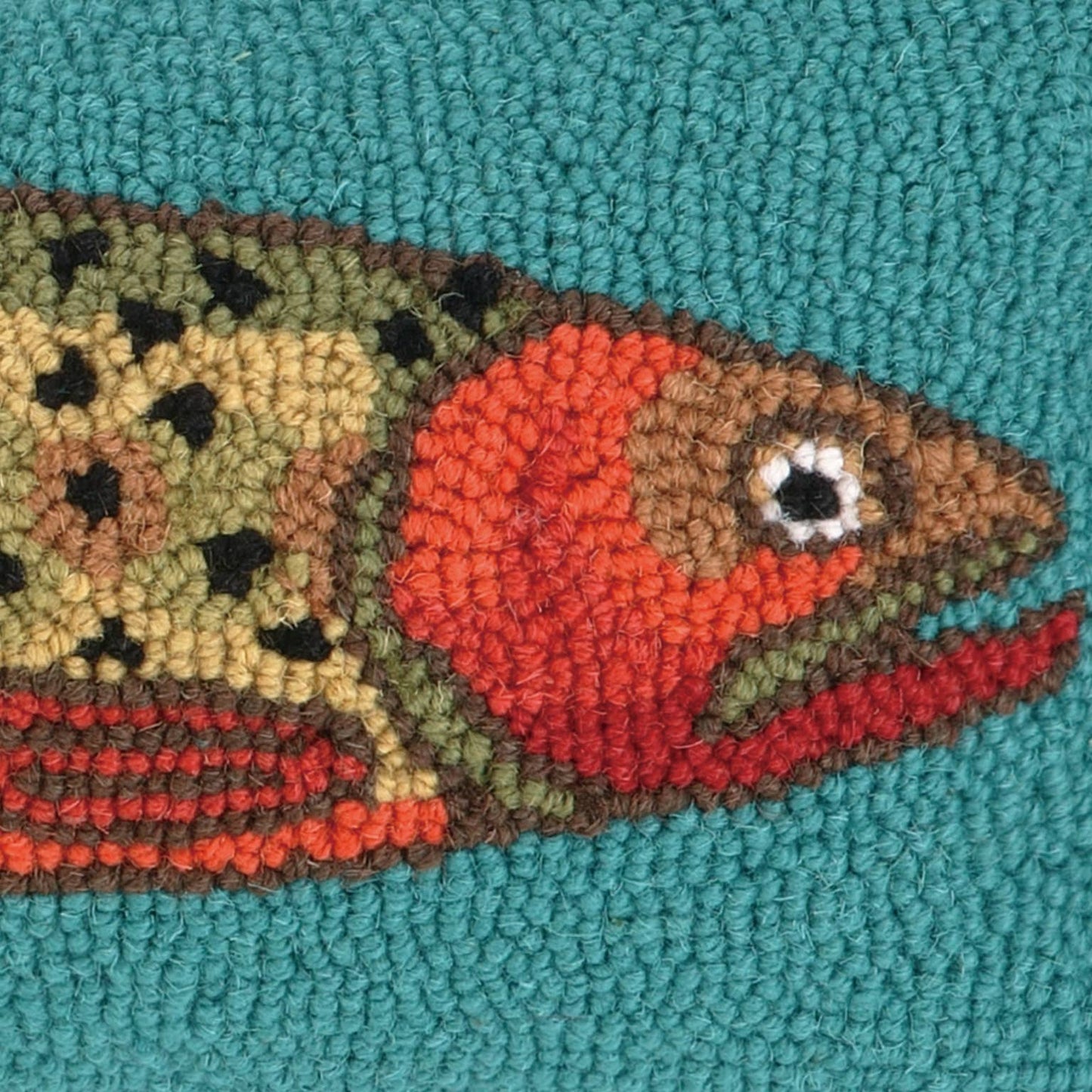 Textured fish design on a teal background