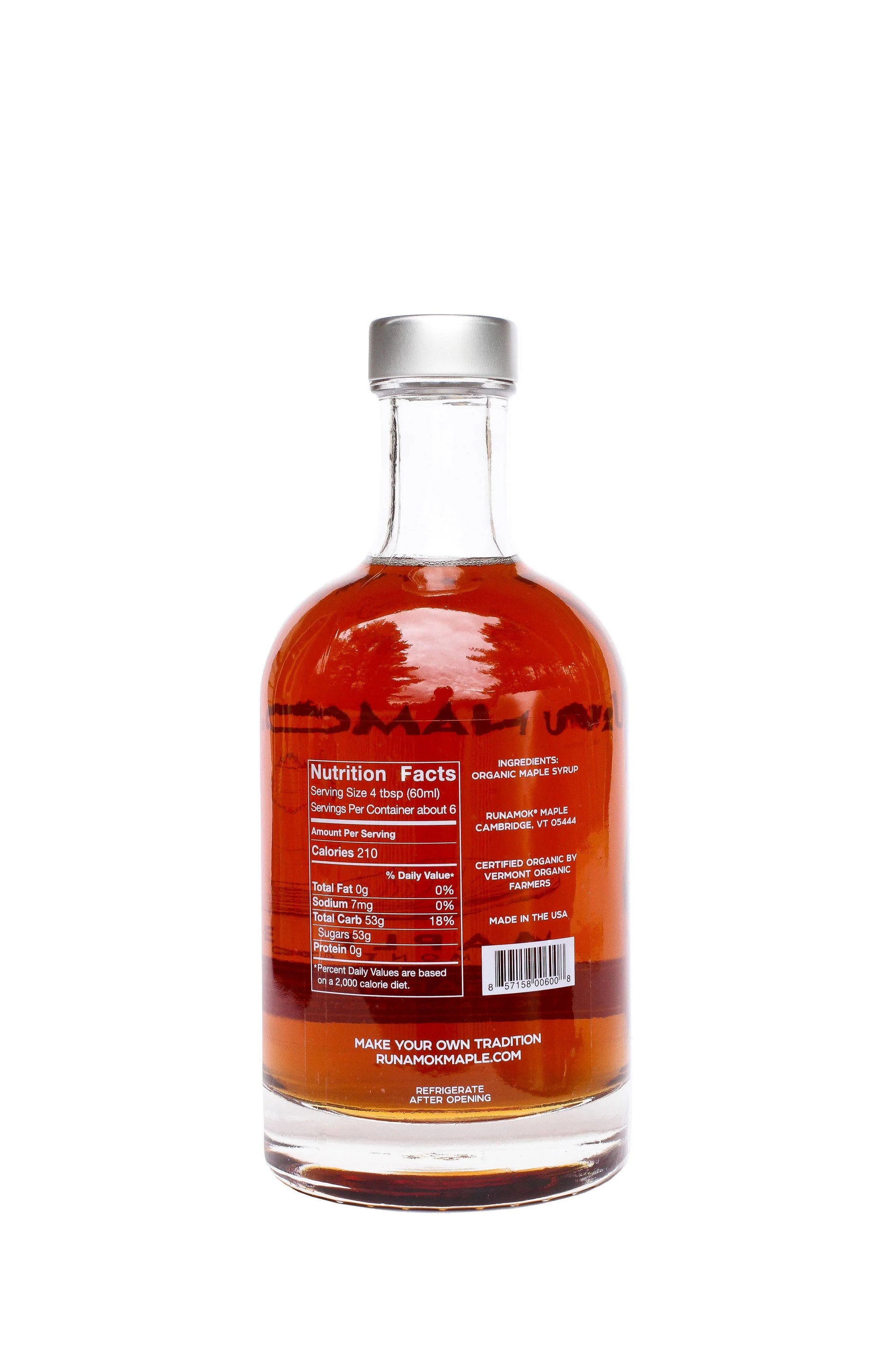 Bottle of syrup with a label on a white background