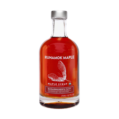 Bottle of Runamok Maple syrup with a red label on a white background