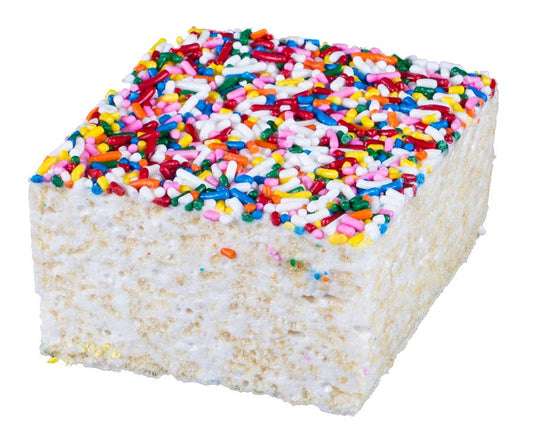 Square piece of cake with colorful sprinkles on a white background