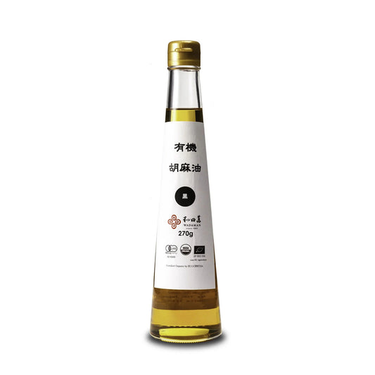 Bottle of sesame oil with a white label on a white background