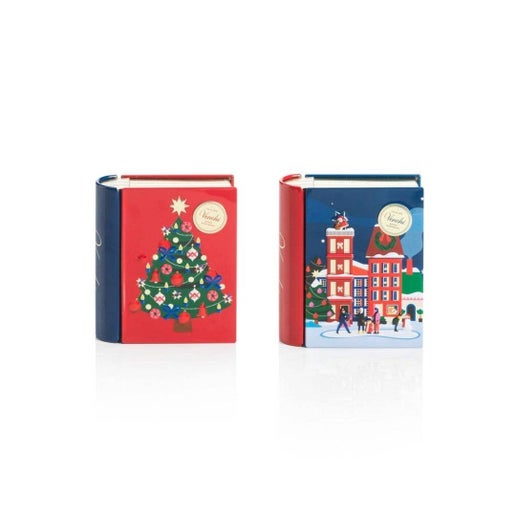 Two Christmas-themed tins with festive designs on a white background